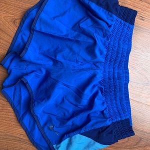 Bright blue nike running shorts